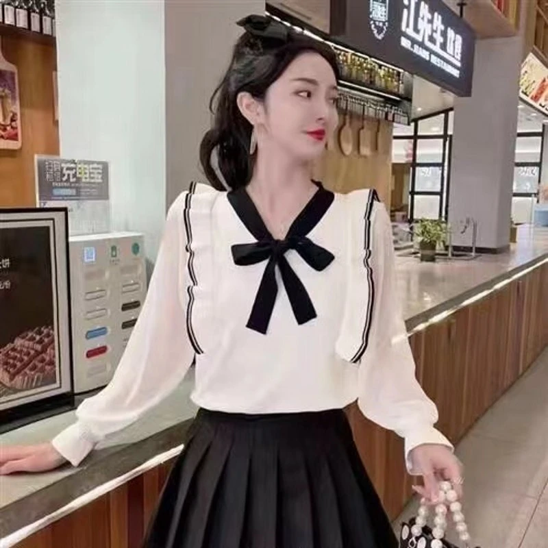 5478#春秋拼色蝴蝶结宽松针织套头衫女新款木耳边喇叭袖微透上衣