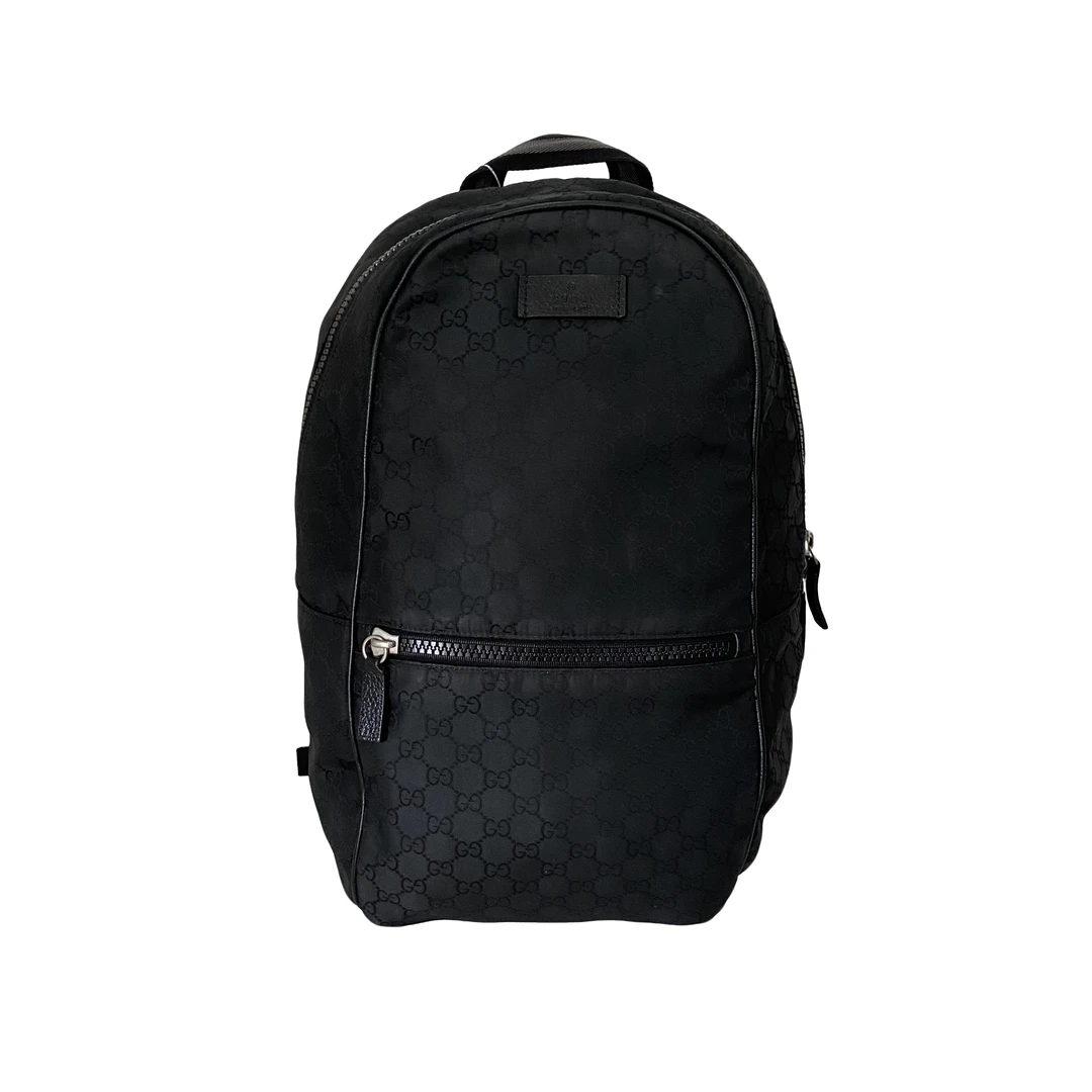 99新 GUCCI/古驰 男士休闲时尚百搭帆布黑花双肩包/62