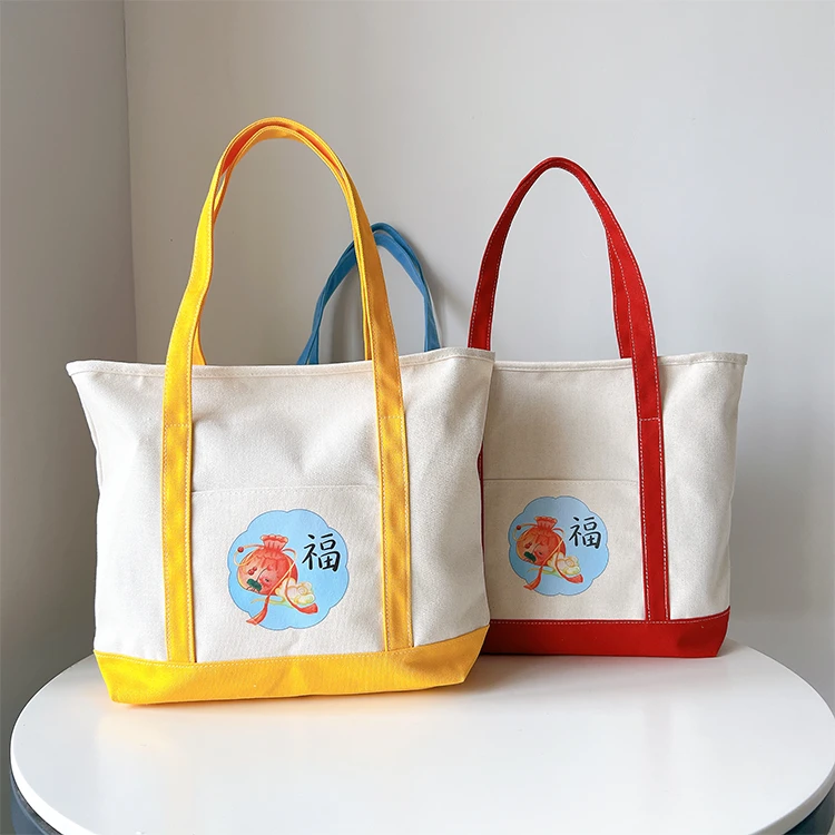 新款帆布包帆布拎包妈咪便携手提包便当包卡通可爱字母托特包