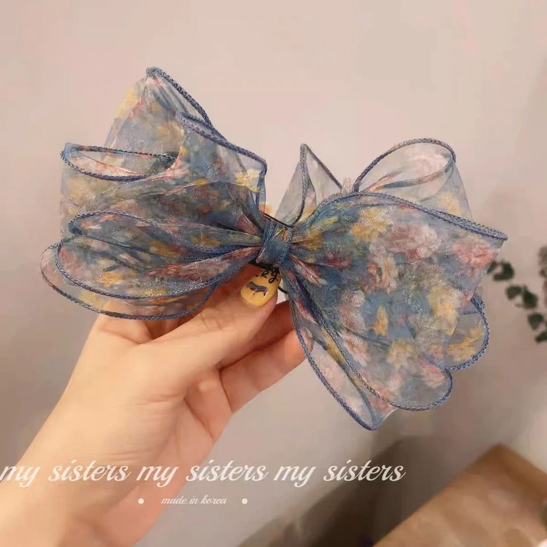 韩国东大门气质碎花蝴蝶结香蕉夹T032101