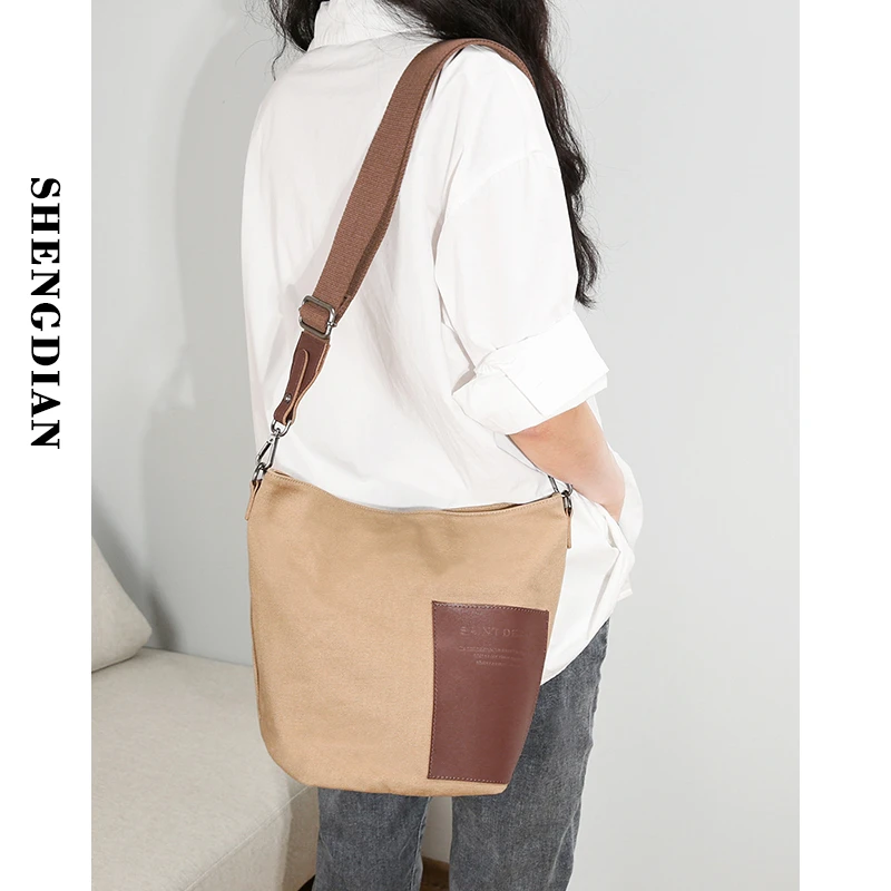 圣迪安原创水桶包女复古质感拼皮单肩包女上班轻便加密帆布斜跨包