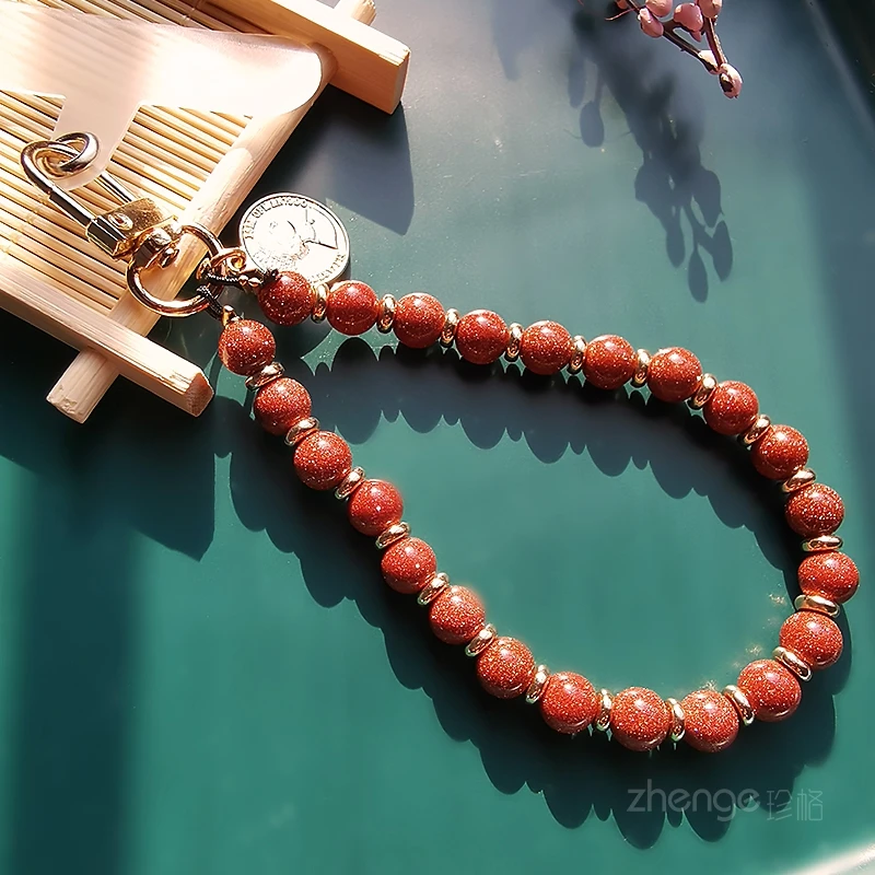 高档手机挂链＆精品手作ins时尚山楂色圆珠挂饰挂链夹片式手机壳