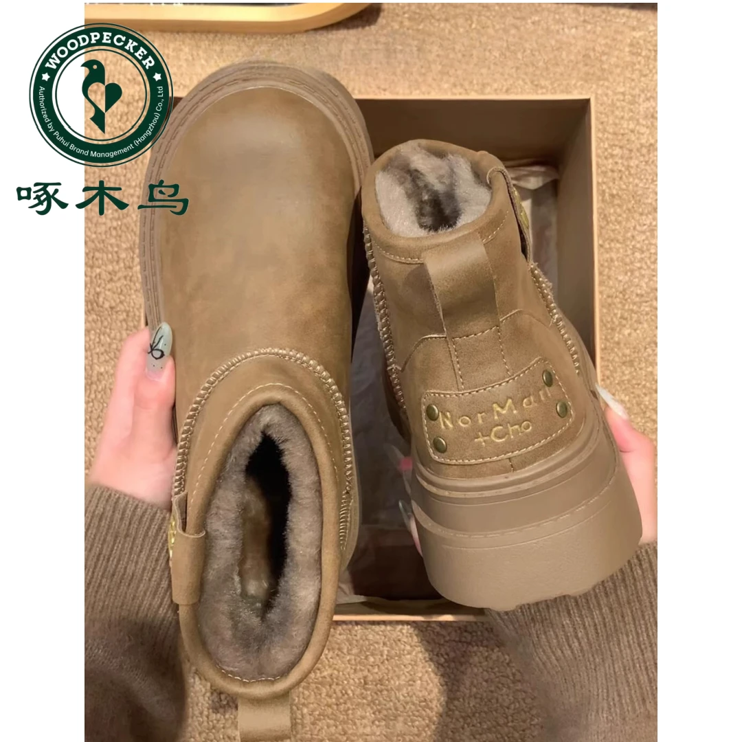 啄木鸟皮毛一体桑坡雪地靴女冬新款防滑短靴复古厚底加绒保暖棉靴