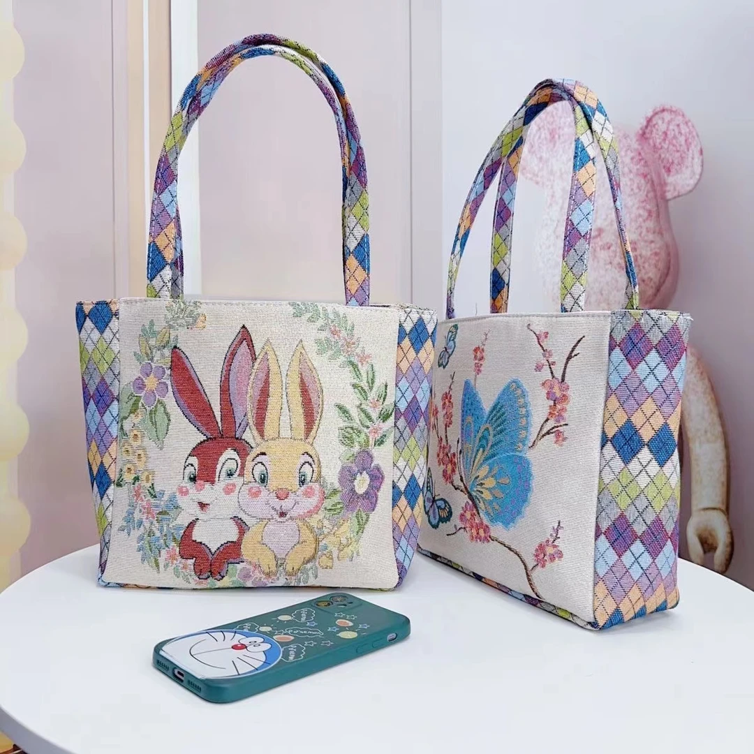新款菱格包双面卡通织秀百搭大容量帆布包便当包手拎包