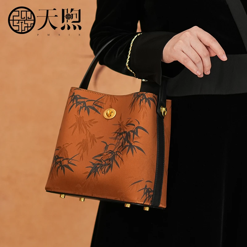 天煦非遗国风新中式国风真皮竹叶印花手提包百搭单肩斜挎水桶包